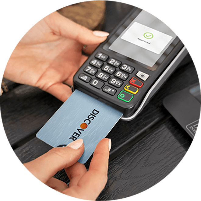 person inserting chip card to pay